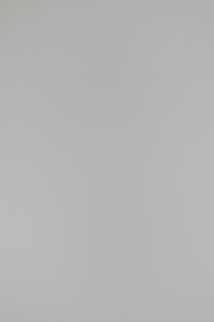 woman wearing a black v-neck cashmere sweater on a white background