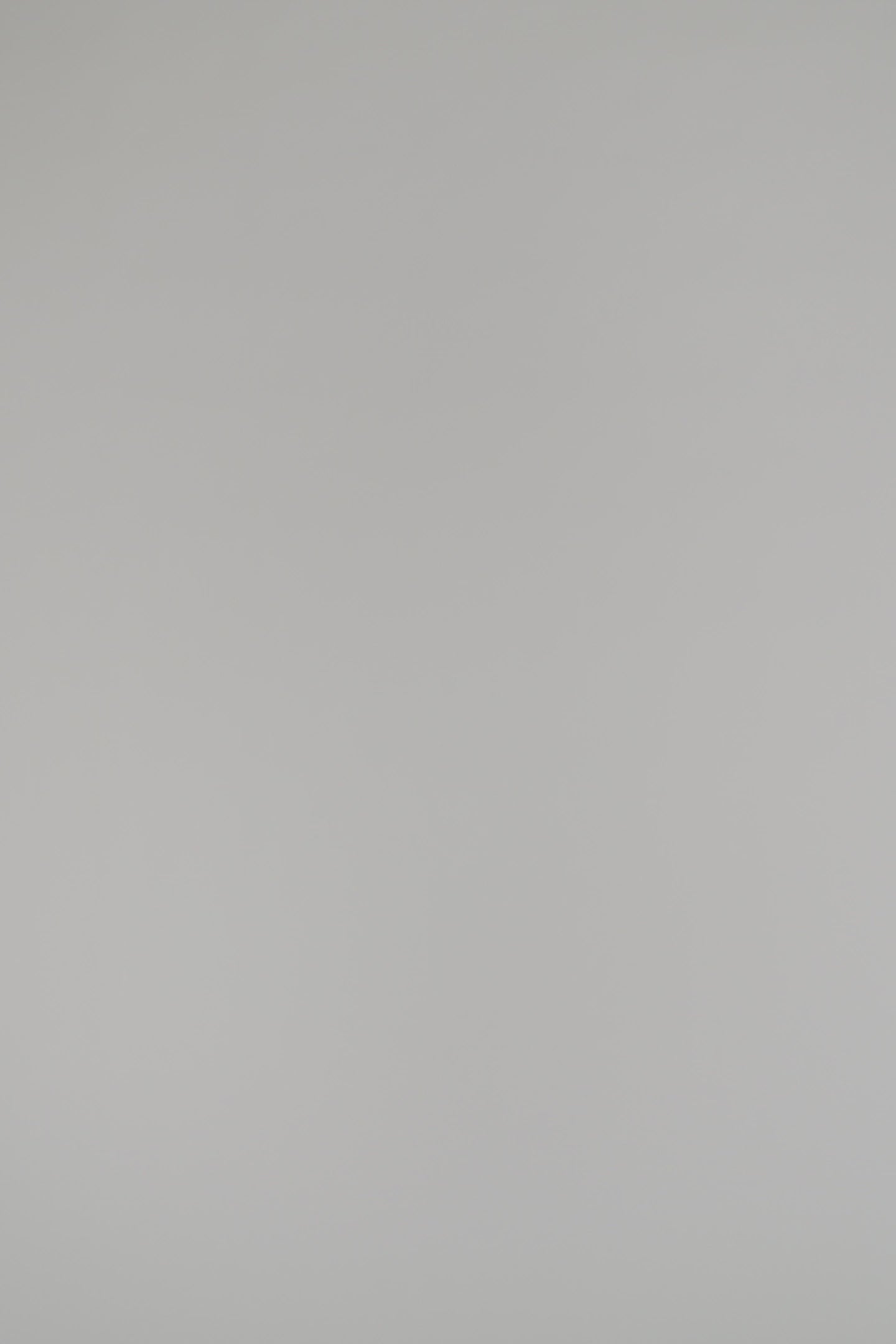 woman wearing navy shell on a white background