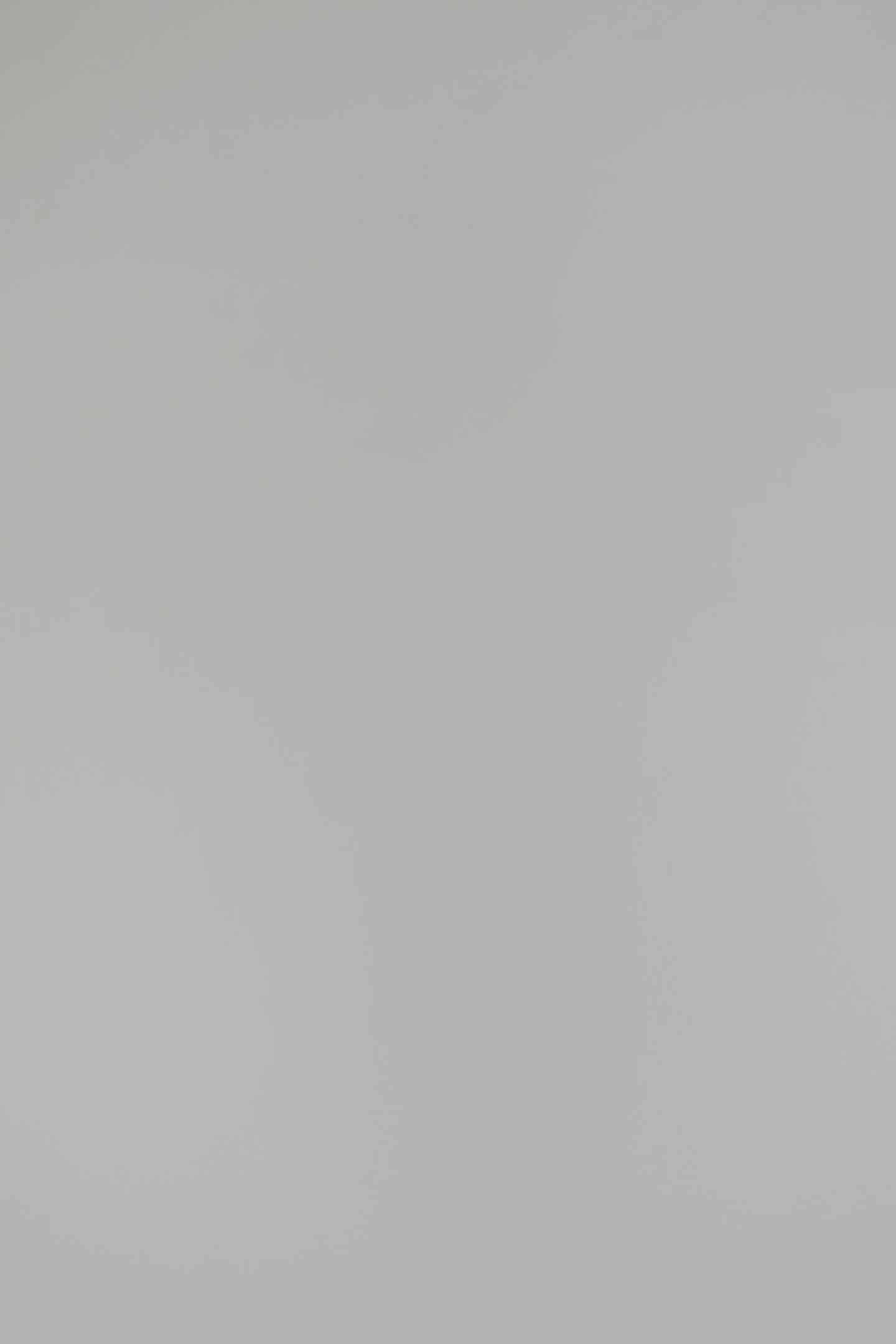 woman wearing a black cashmere cardigan on a white background