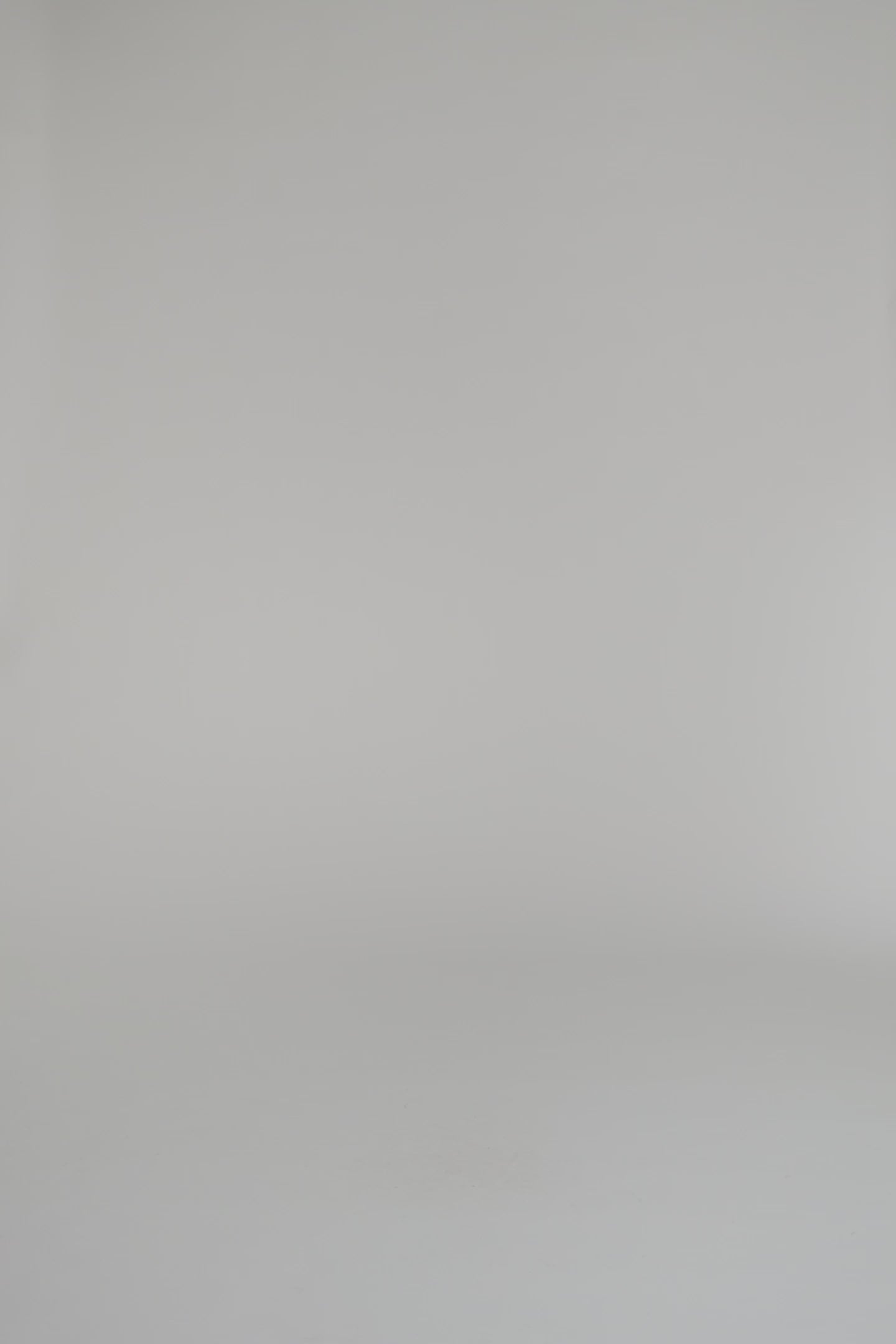 woman modeling merlot patterned wrap on a white backdrop