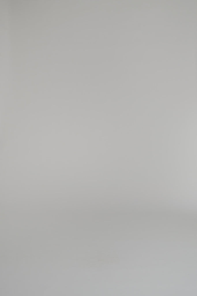 woman modeling reversible crewneck and shorts on a white background