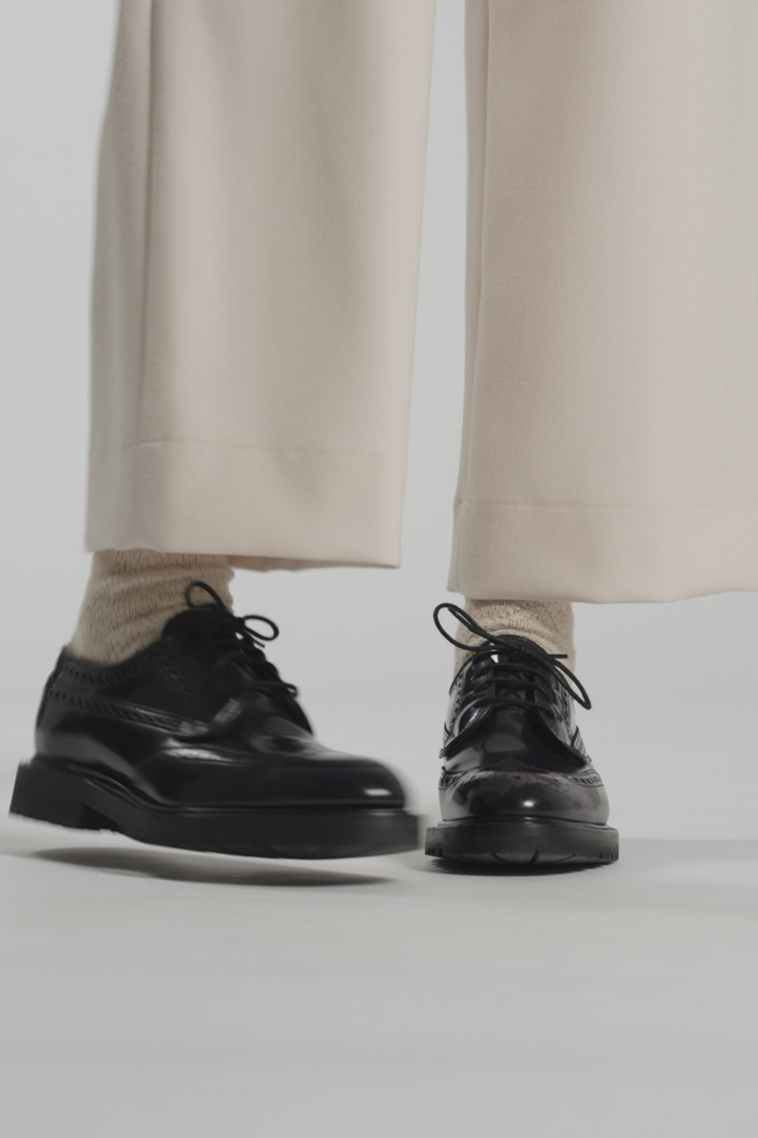 Video in a white studio of navy shoes