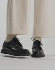 Video in a white studio of navy shoes