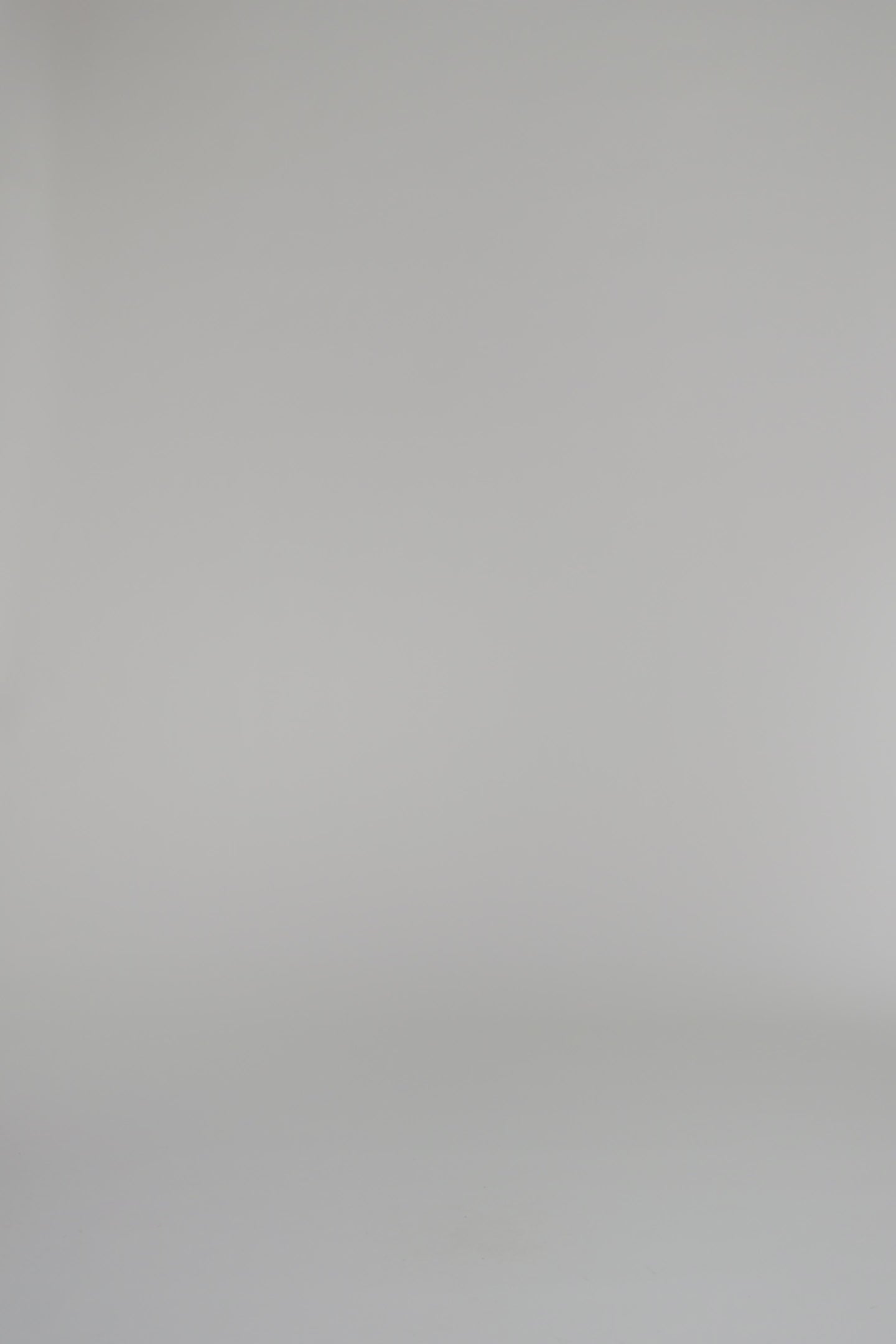 woman wearing french blue cardigan and matching skirt set on a white background