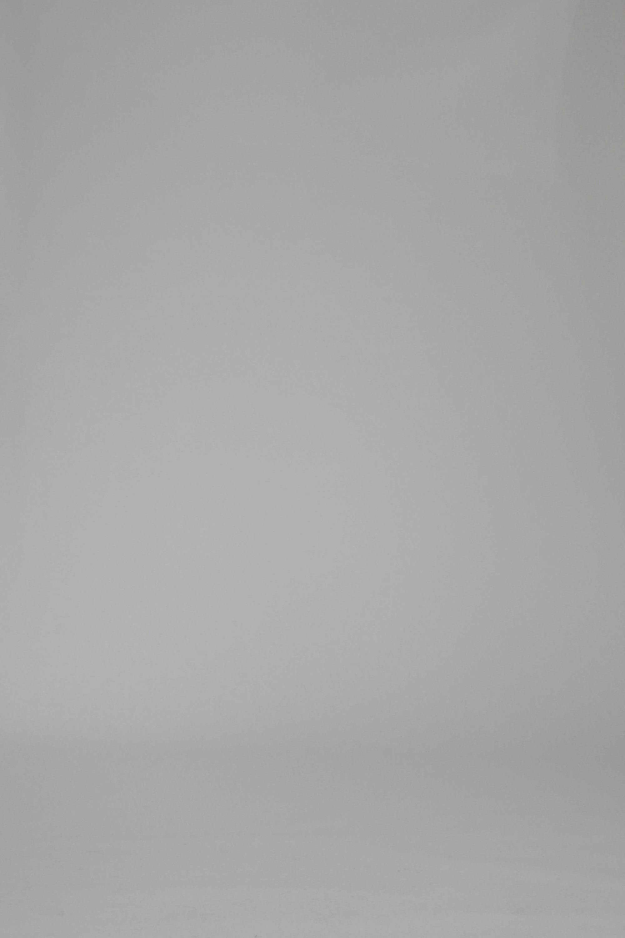 Woman modeling a blue and white striped long sleeve dress on a white backdrop