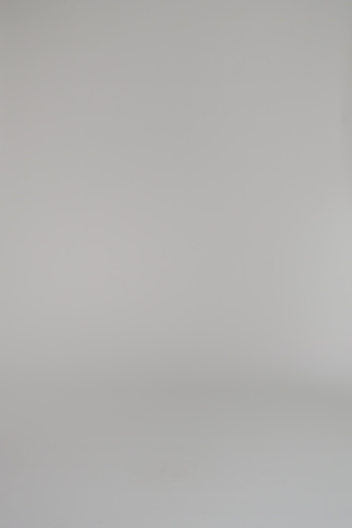 woman wearing pink cardigan and matching skirt set on a white background