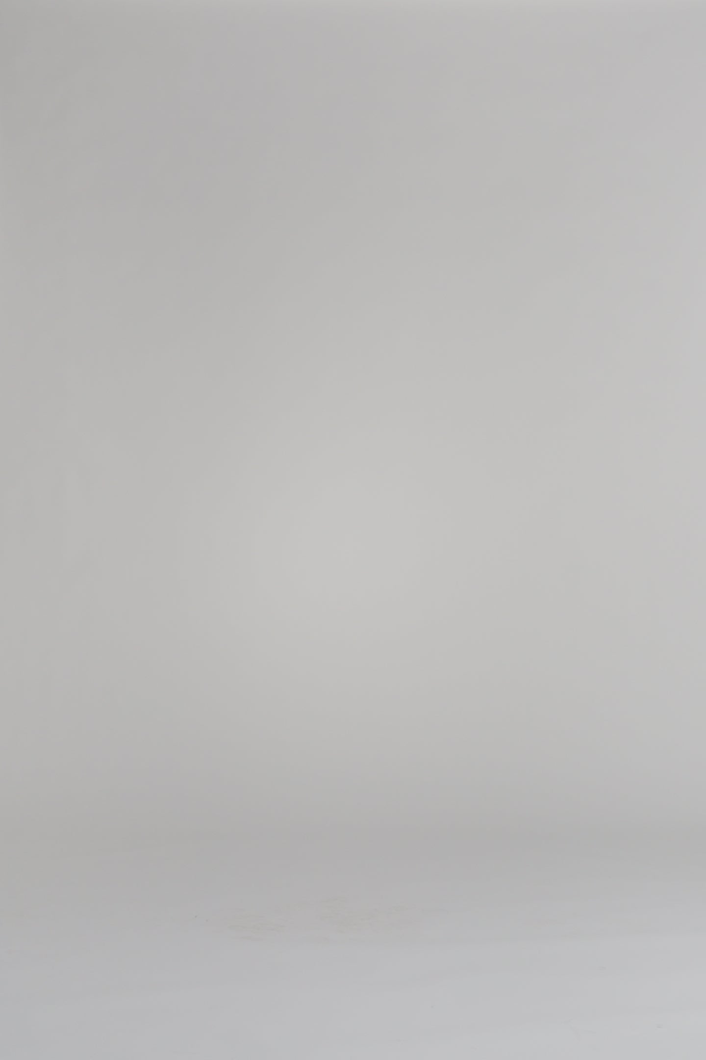 woman modeling navy cardigan on a white background