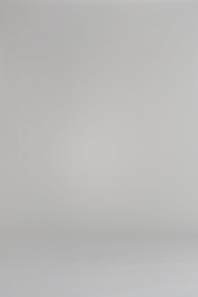 woman modeling navy cardigan on a white background