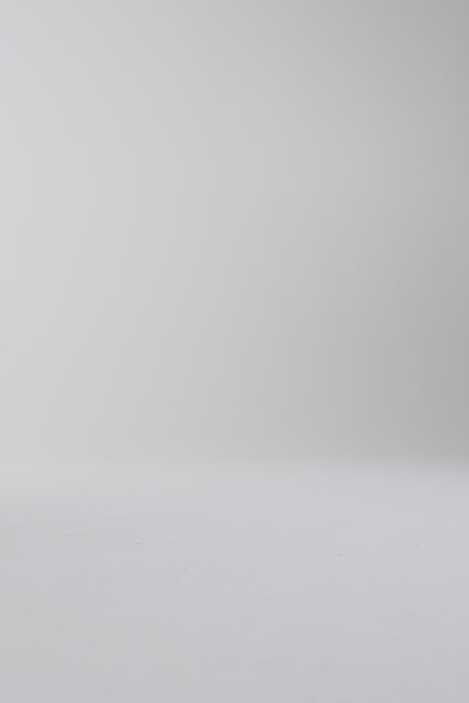 Woman walking in dark brown shoes on a white background