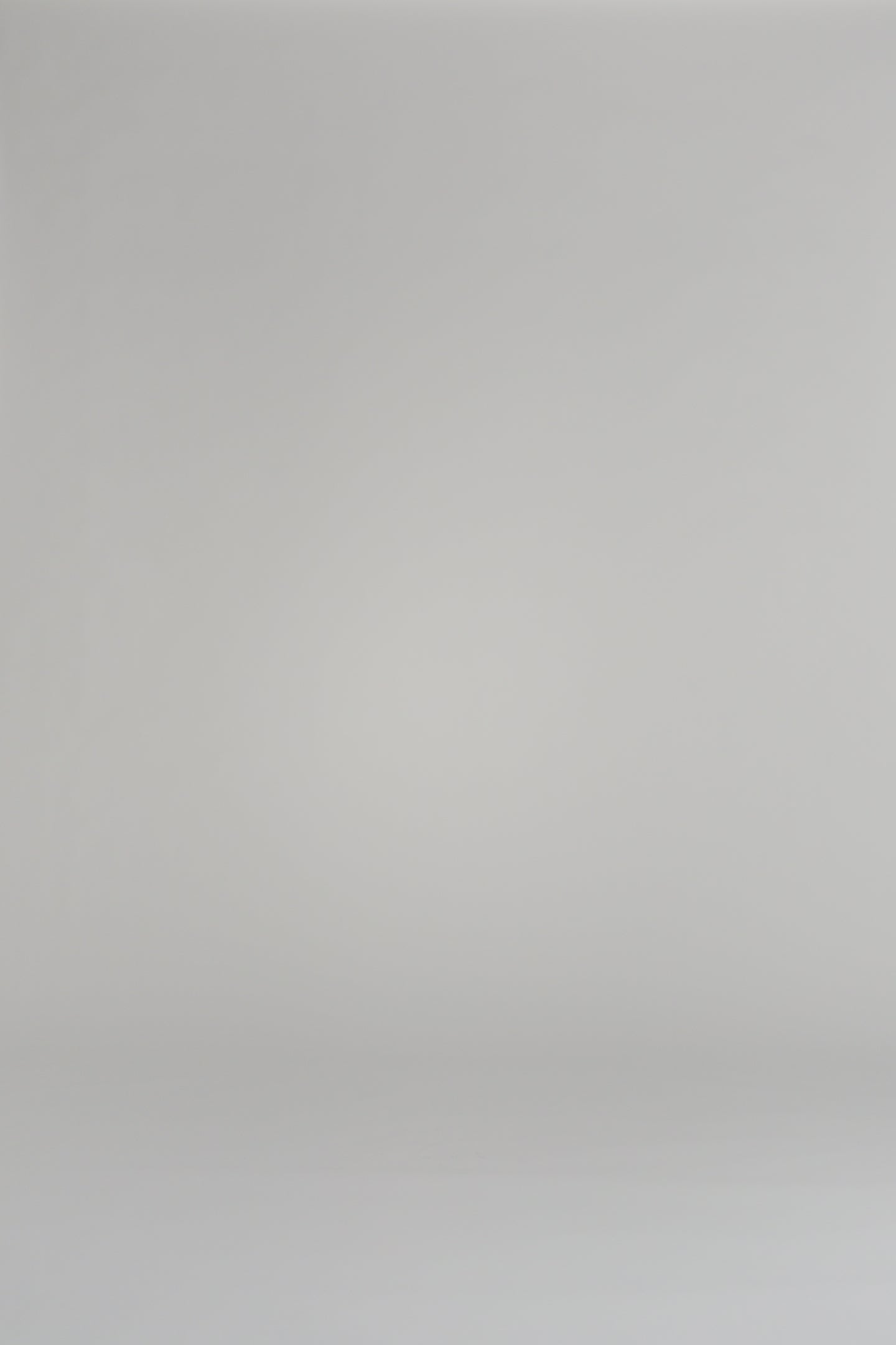 woman modeling blue patterned shorts on a white background