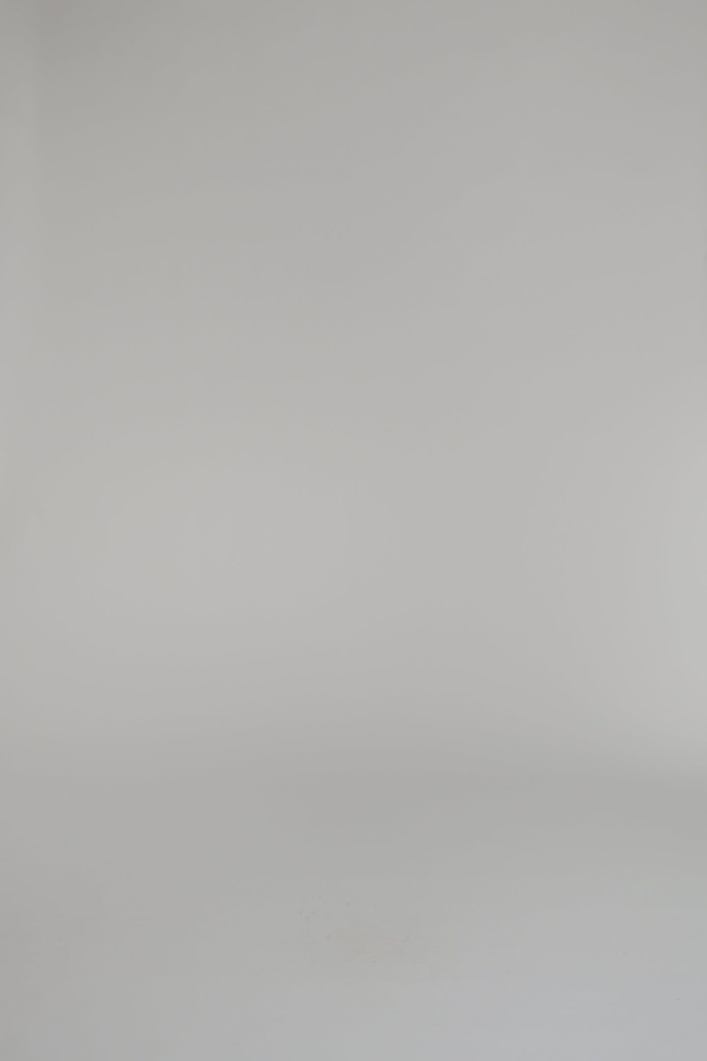 woman wearing pink sweater and skirt on a white background