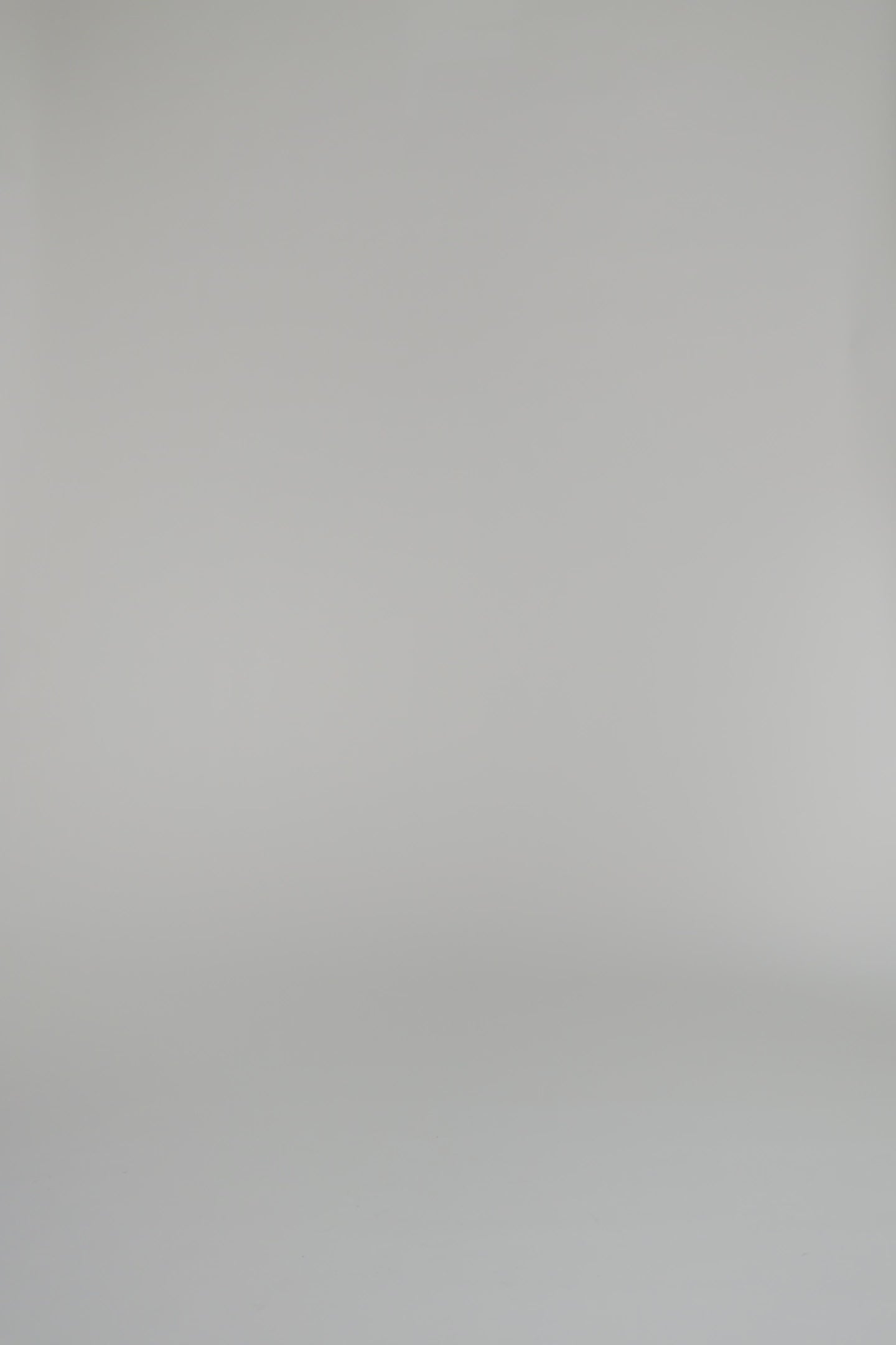 video of woman wearing chambray shirt dress on a white background