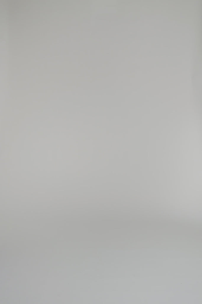 video of woman wearing chambray shirt dress on a white background