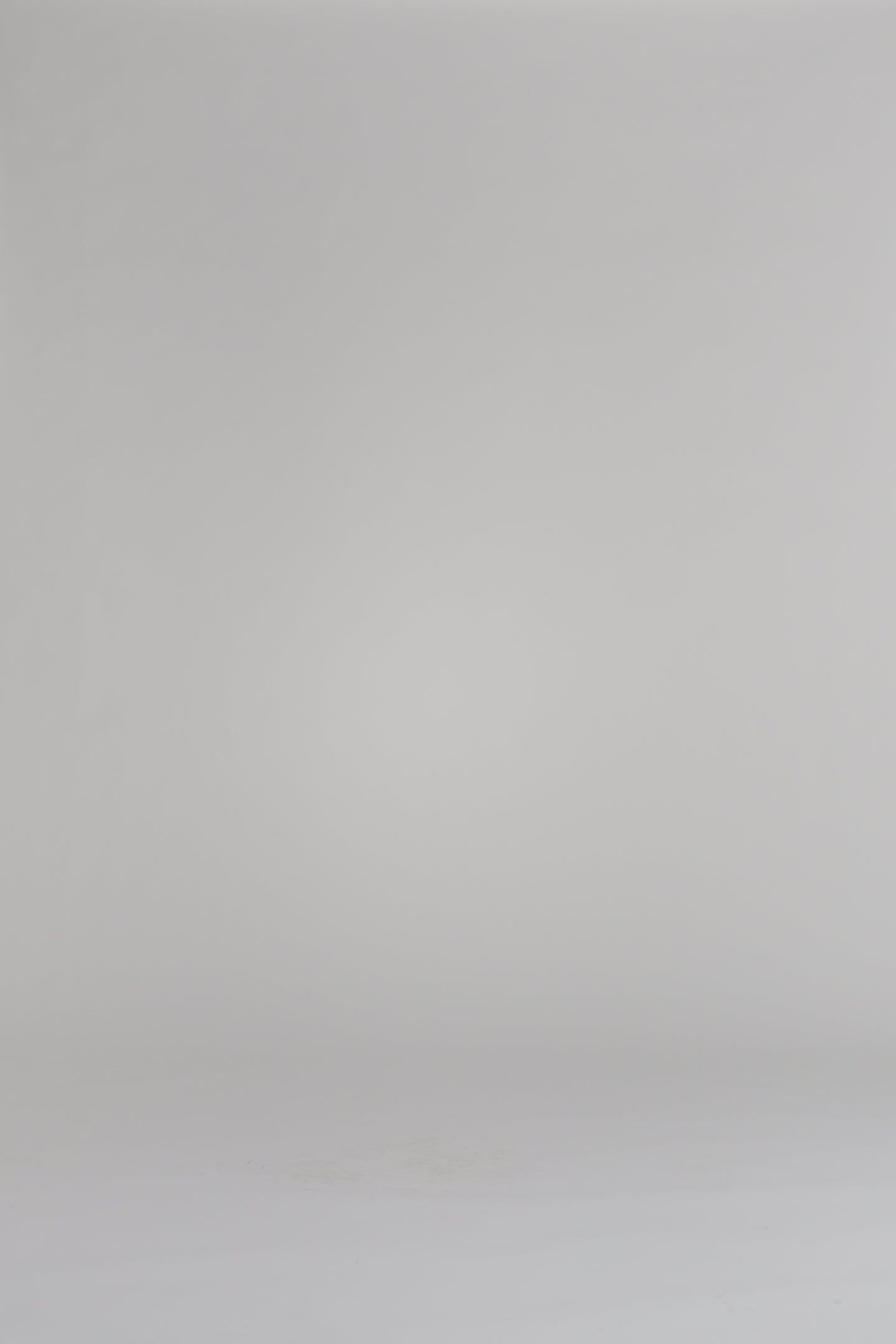 woman wearing a pink sweater on a white backdrop