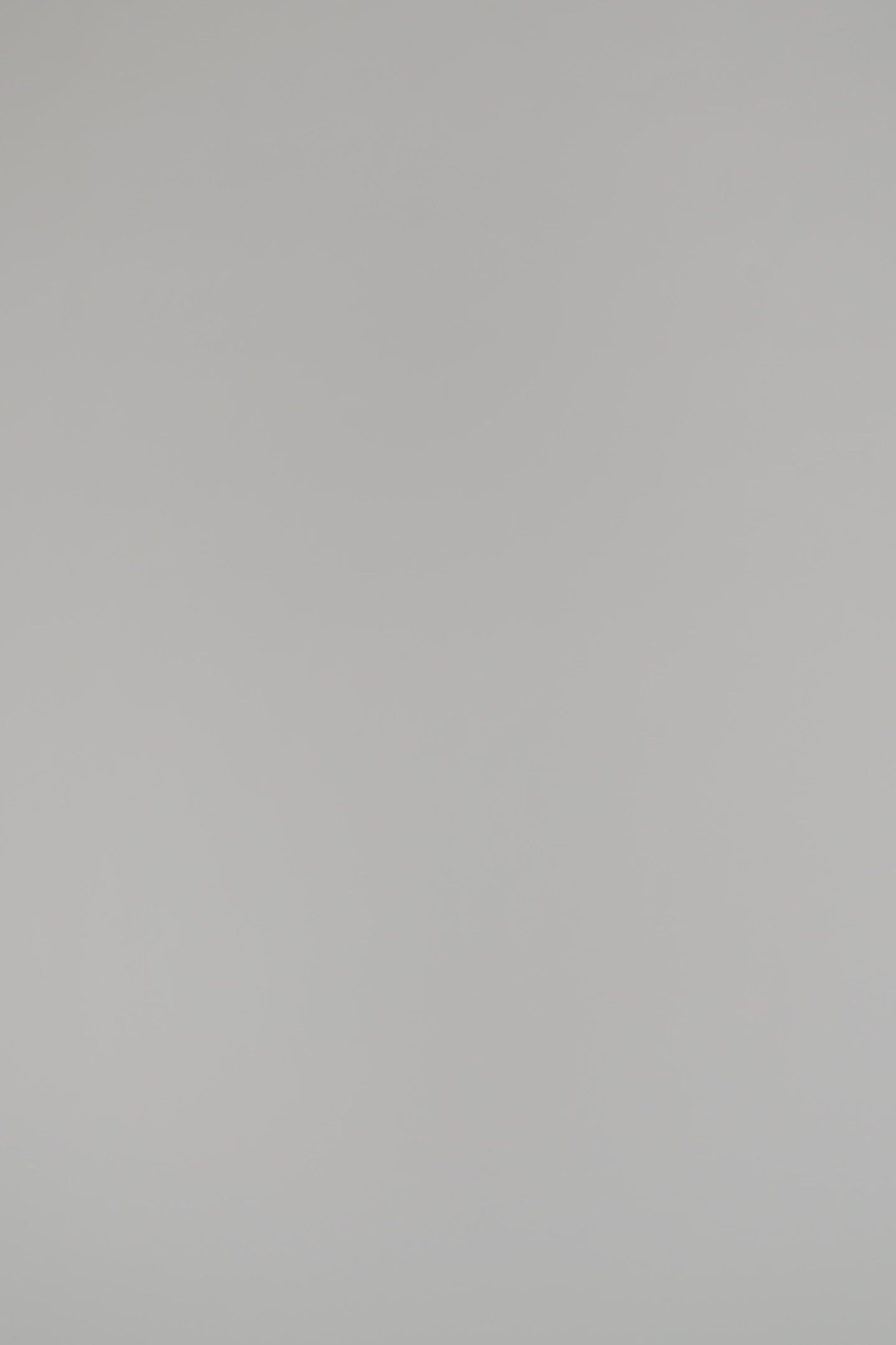 woman wearing a navy sweater on a white background