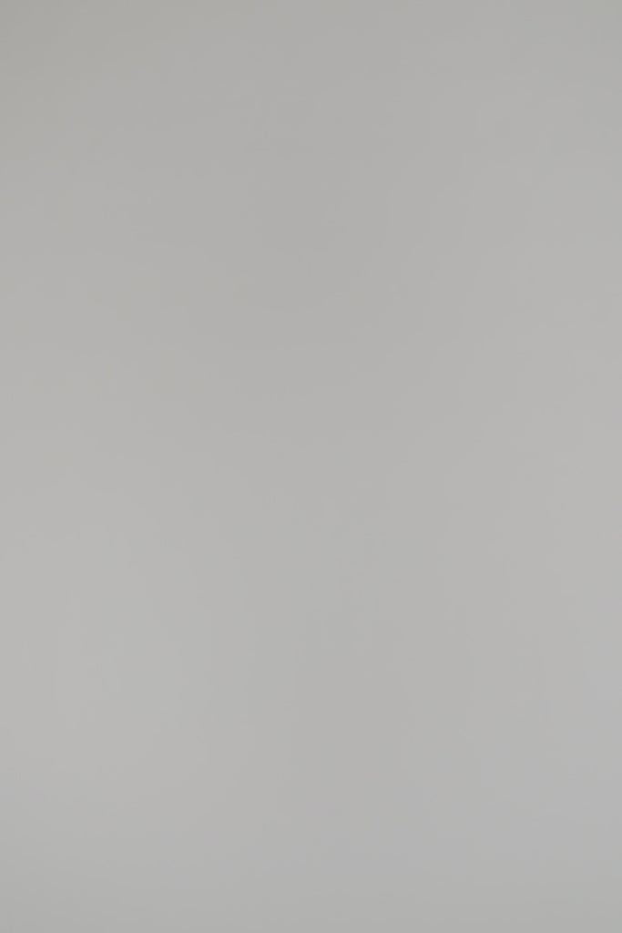 woman wearing a navy sweater on a white background