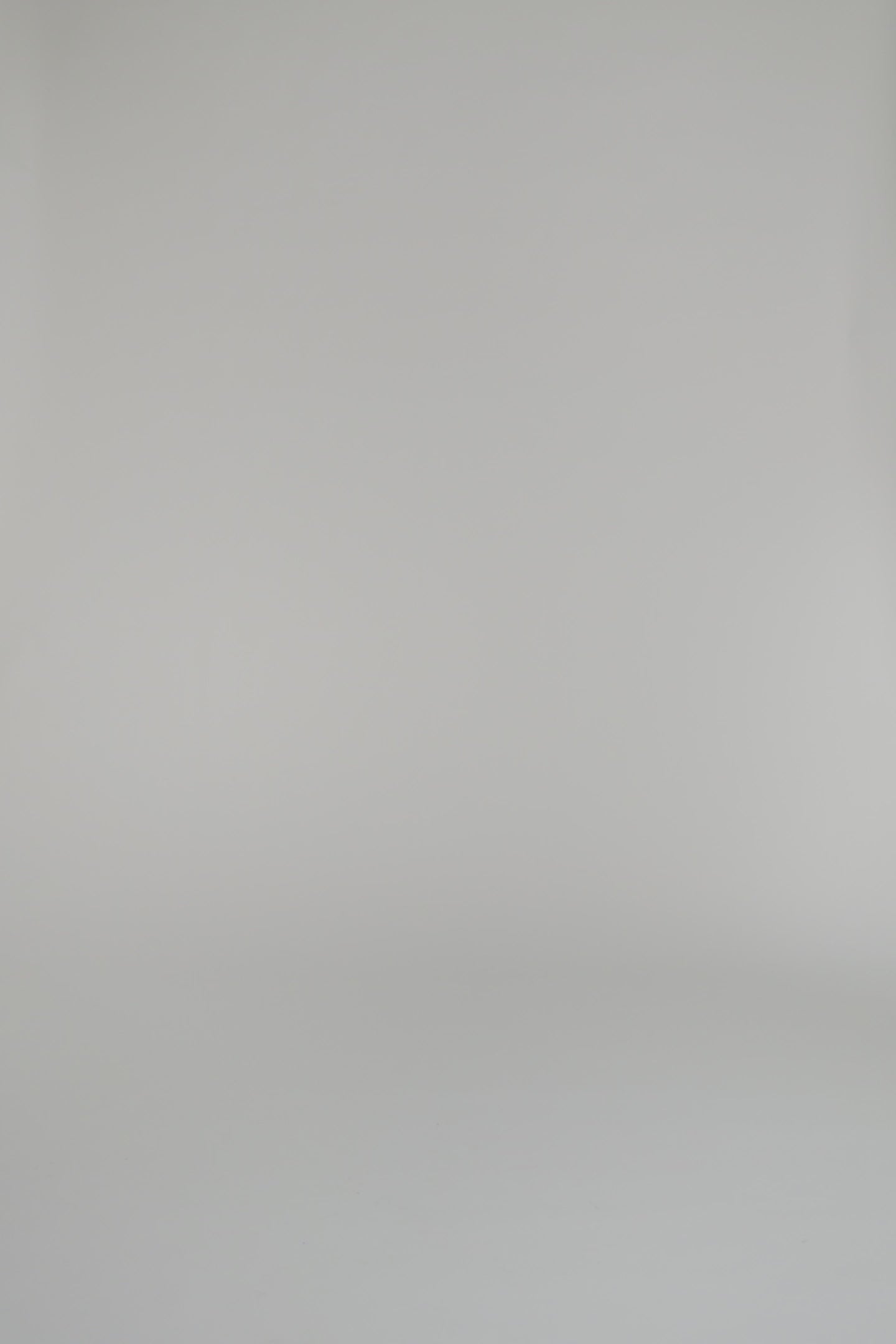 woman modeling blue long sleeve dress wearing heels on a white backdrop